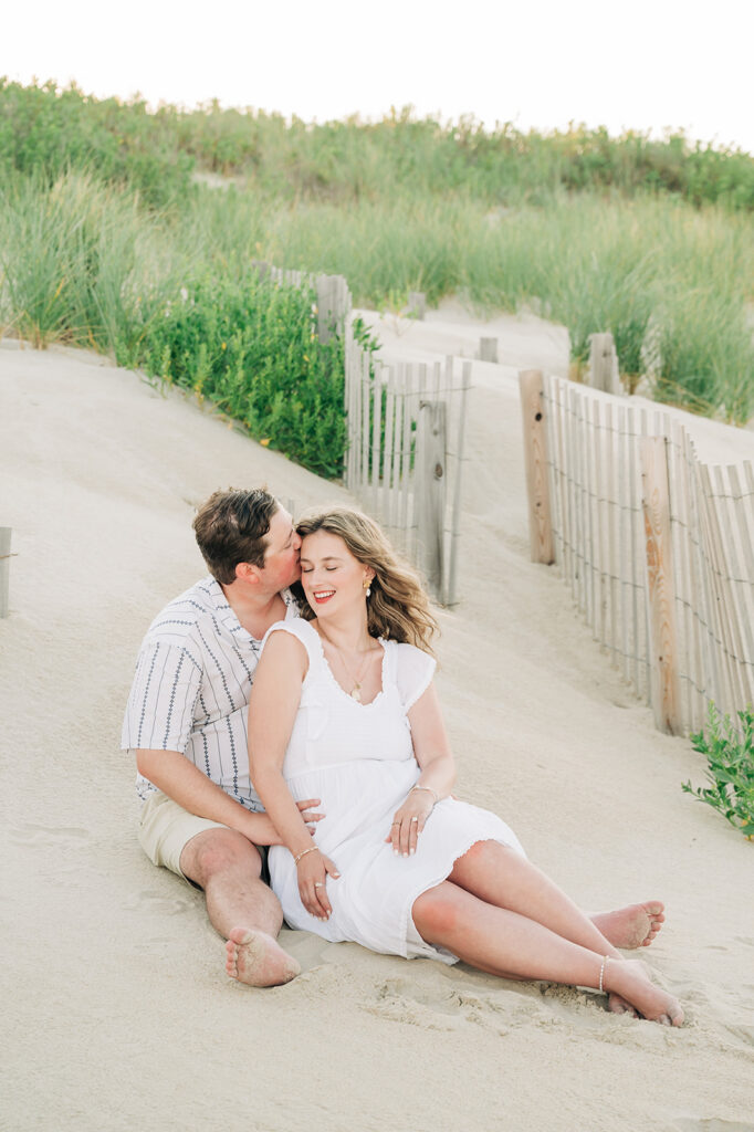 Couple sitting in dune in OBX